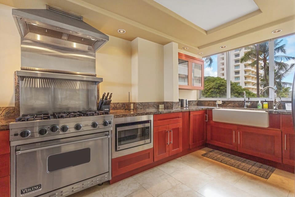 Kitchen - All major appliances available for all your cooking needs and extended stay.  Kitchen sink with a view over-looking swaying palm trees and Kapiolani Park.