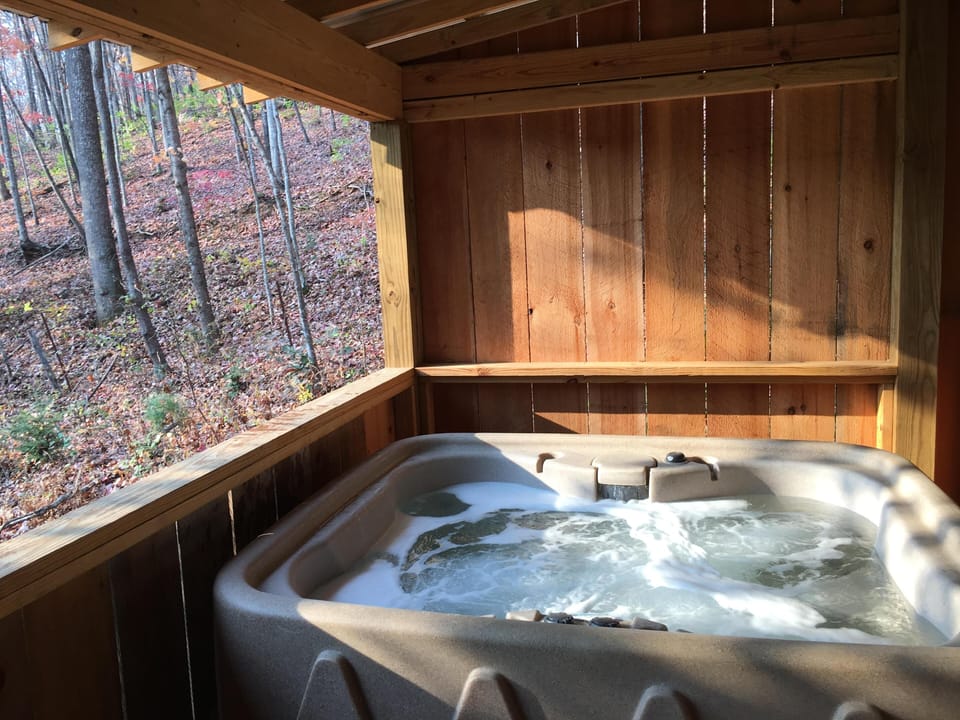 Secluded hot tub retreat surrounded by peaceful woods