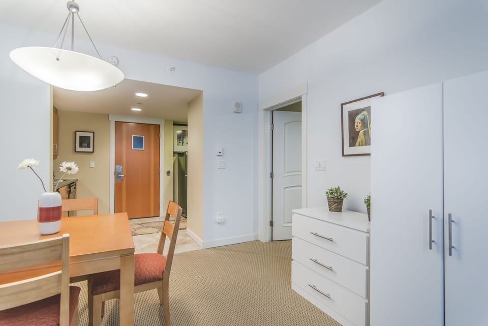 Dining area - Offers small dresser and wardrobe for luggage storage or unpacking. These pieces also offer games, and extra bedding.