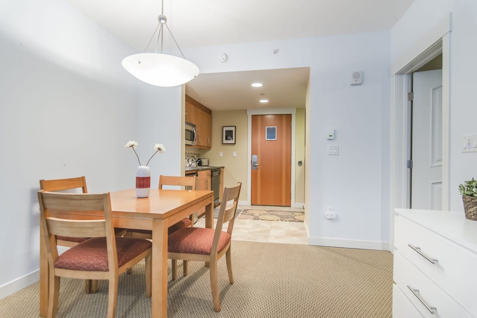 Dining Area - Seating for four located next to the kitchen and bedroom.