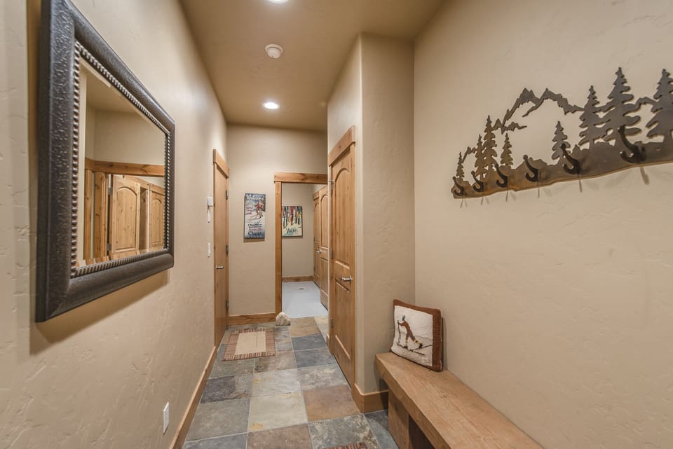 Entry - Entry hallway located on the first floor with bench and coat hooks.