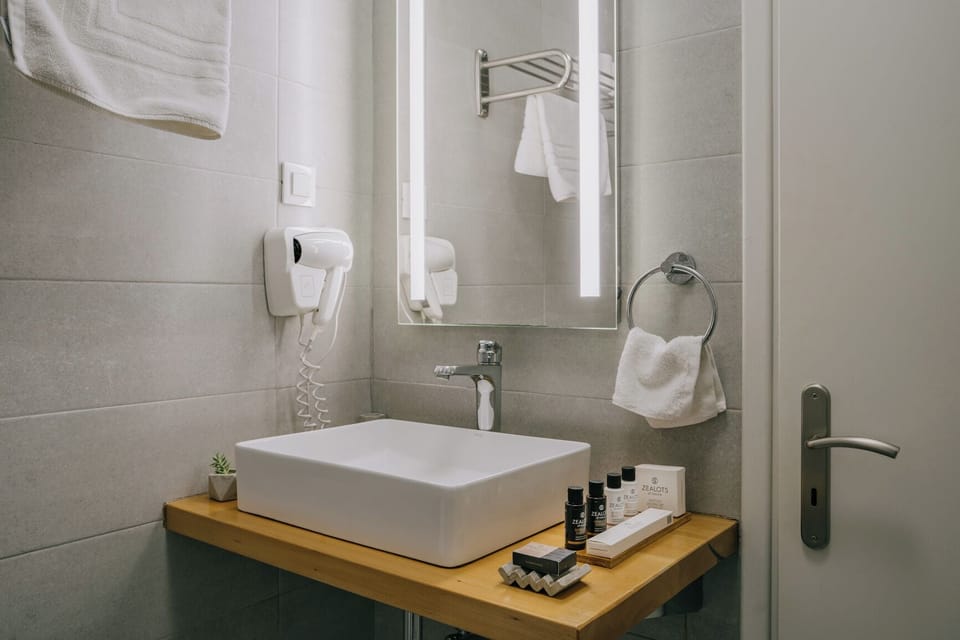 Deluxe Triple Room, 1 Bedroom, Balcony, Sea Facing | Bathroom | Shower, hydromassage showerhead, designer toiletries, hair dryer