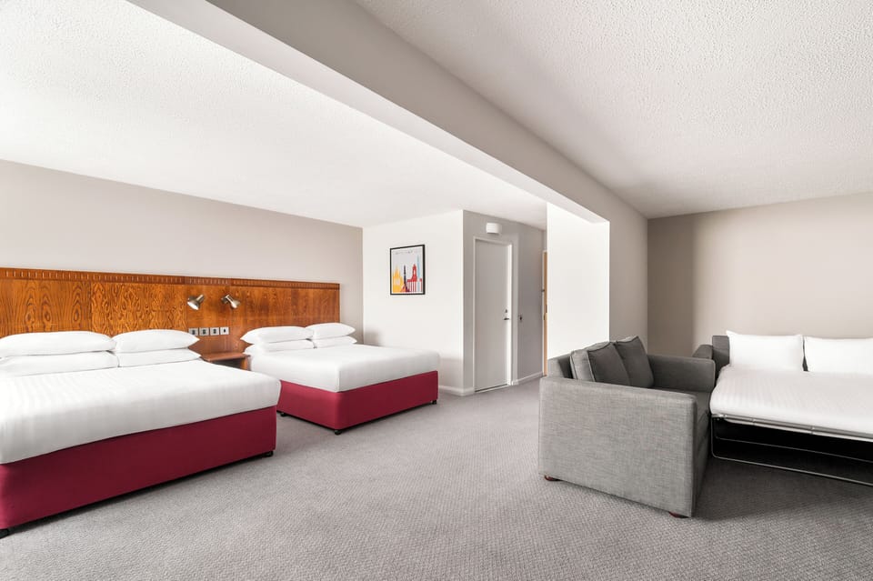 Suite, Multiple Beds | In-room safe, desk, laptop workspace, blackout drapes