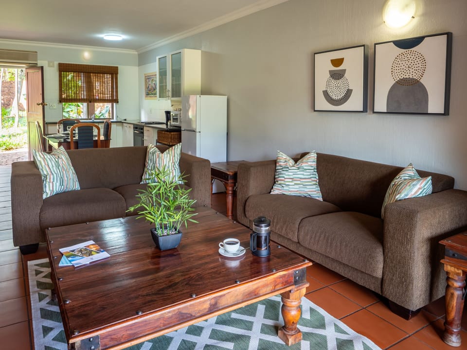 Family Apartment, 2 Bedrooms | Living area | 40-inch LED TV with satellite channels