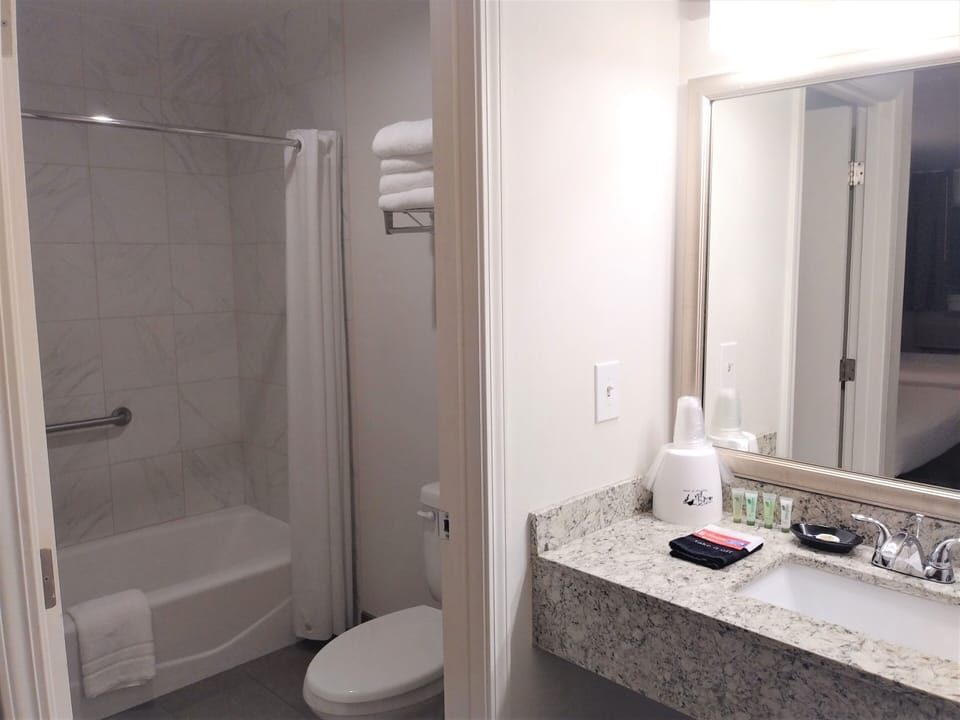 Standard Room, 2 Queen Beds | Bathroom | Combined shower/tub, free toiletries, hair dryer, towels