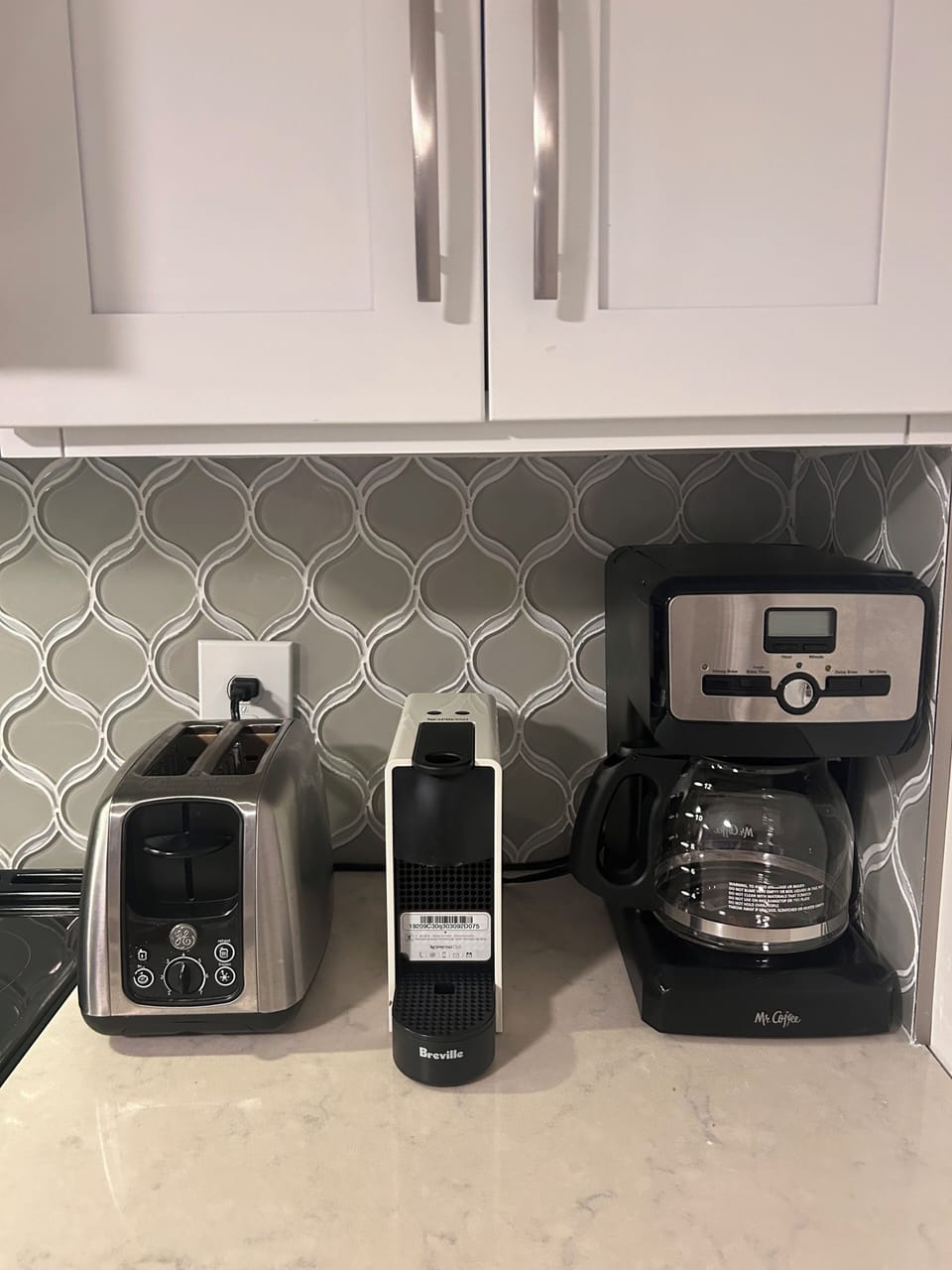 Nespresso* Single Serve and 12 cup Standard (Flat Filter) Coffee Maker.