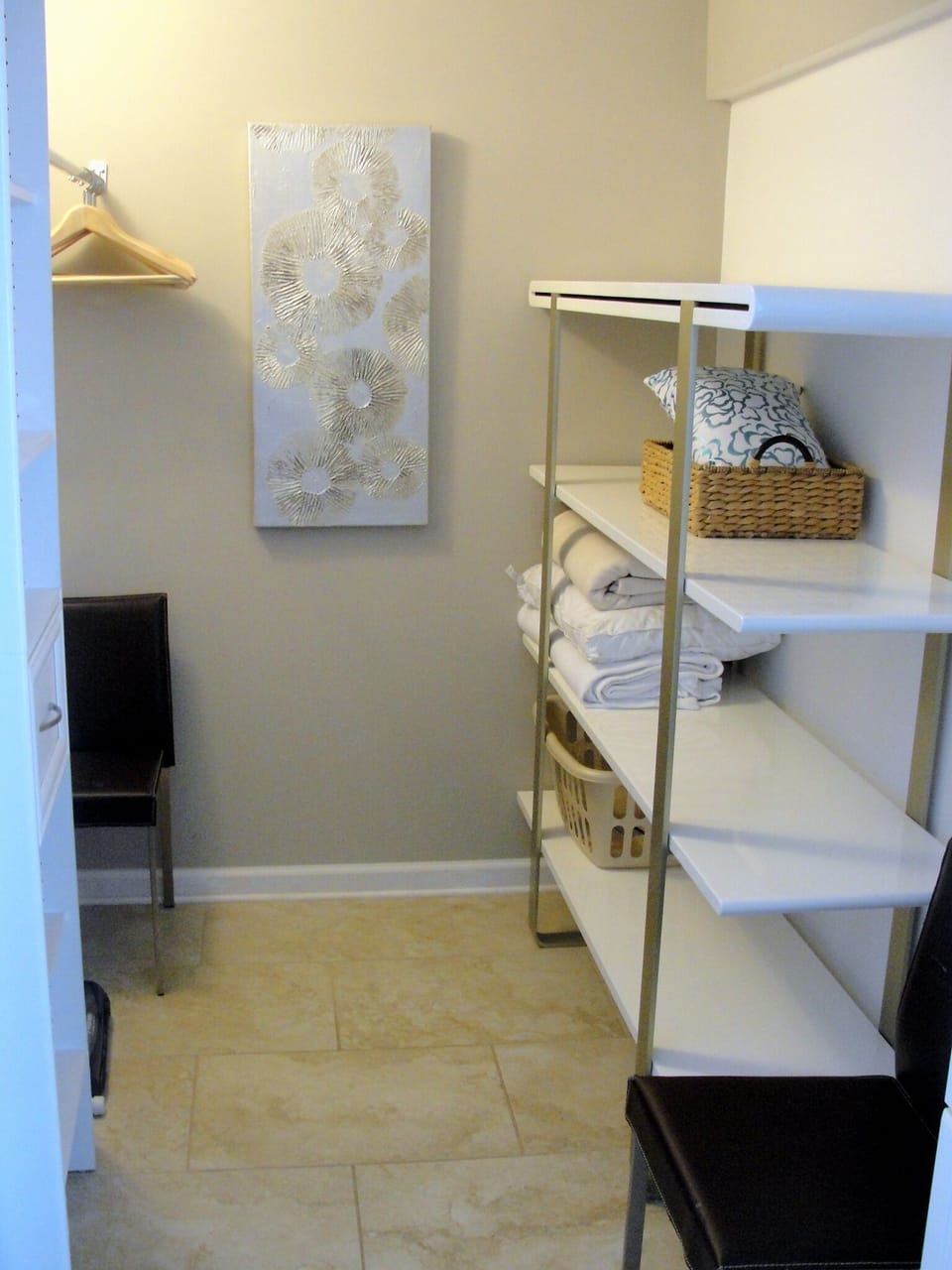 BDRM has open walk-in closet with extra blankets and iron/ironing board.