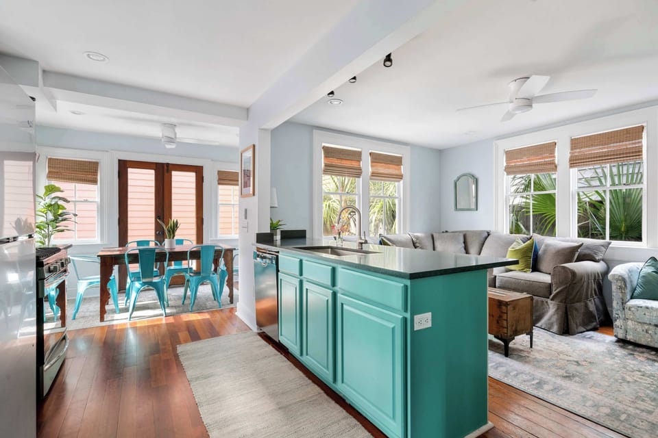 View of the kitchen island, dining and living room