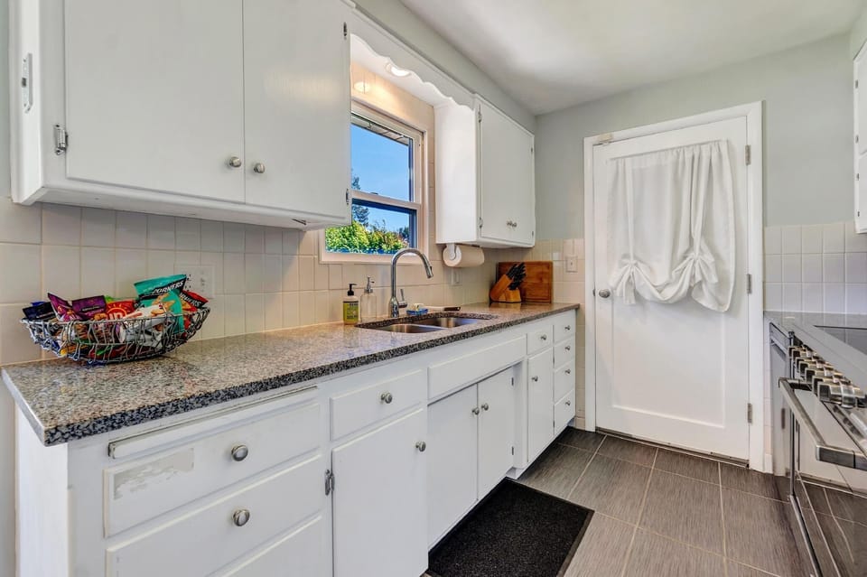 Prepare to be captivated by our newly remodeled kitchen, boasting exquisite granite countertops that add a touch of timeless elegance. 