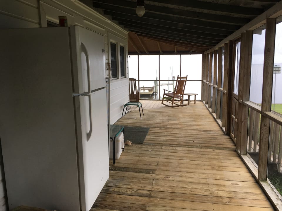 Side porch holds a refrigerator—great for extra beverages. 