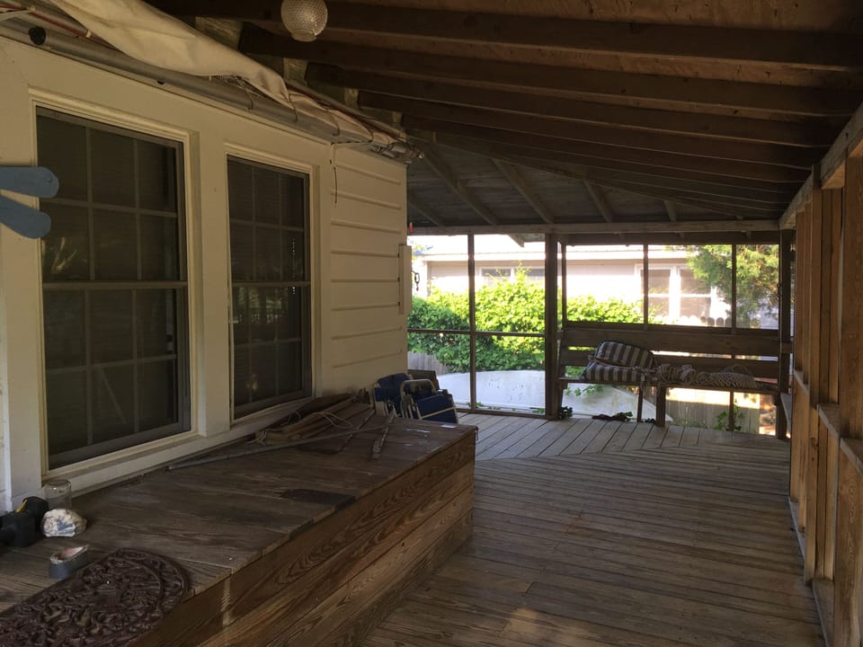 Back porch. Hammock often hangs in the corner. 