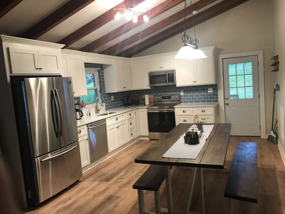 Fabulous kitchen with SS appliances and large farm table for family meals. 