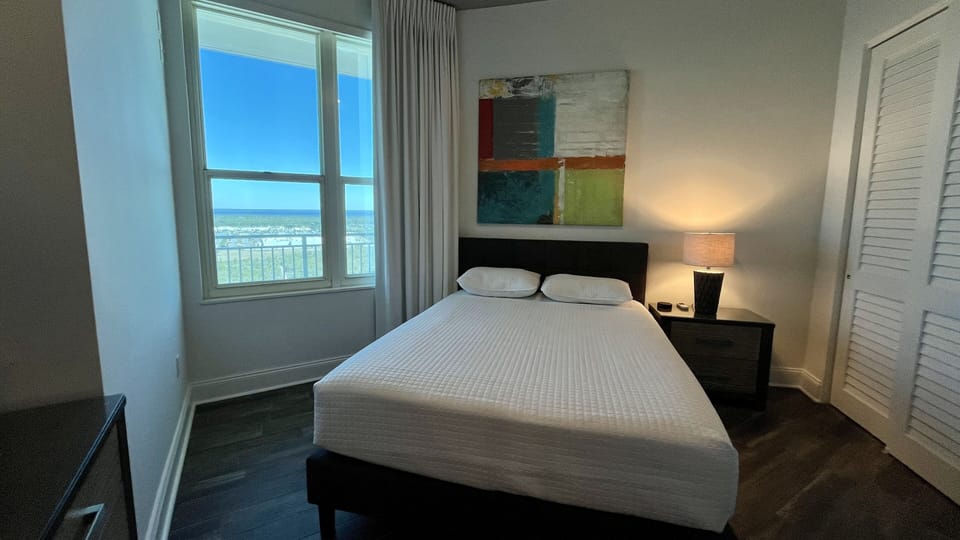 The Queen + Twin Bunks Guest Bedroom has great views of West Bay.......
