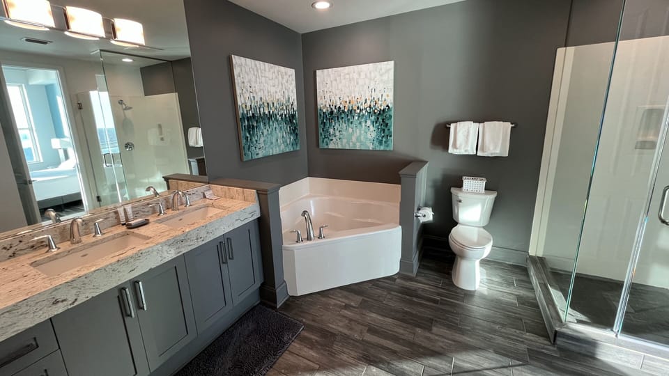 The Master Bath has a frameless glass shower plus a large Garden Tub!