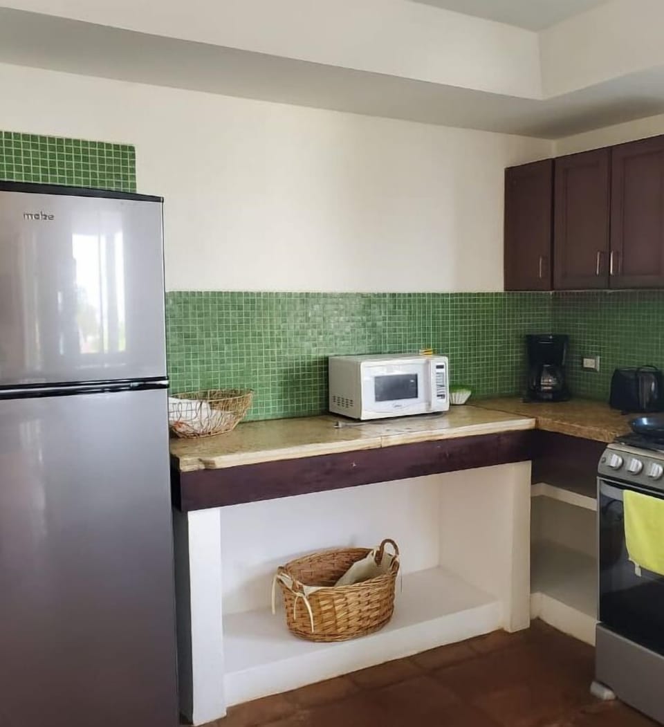 Villa | Private kitchen | Coffee/tea maker, full-size fridge, microwave, cookware/dishes/utensils