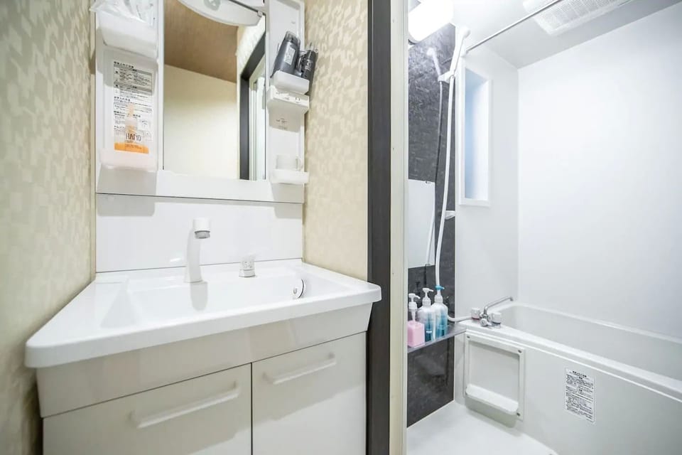 Twin Room | Bathroom | Separate tub and shower, deep soaking tub, free toiletries, towels