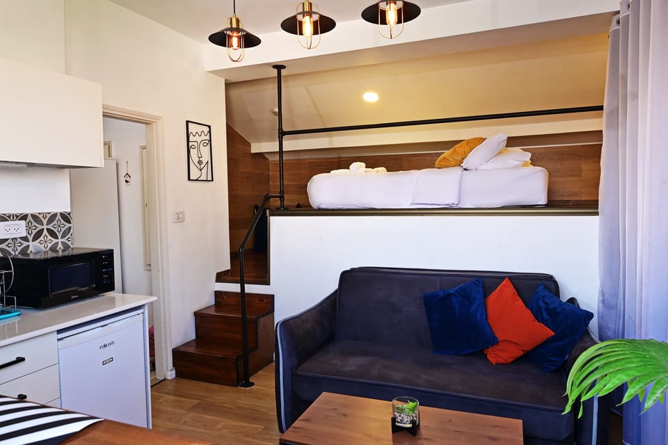 studio with panoramic sea view | Living area | Flat-screen TV