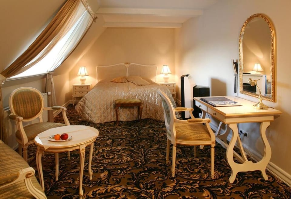 Minibar, desk, blackout drapes, iron/ironing board