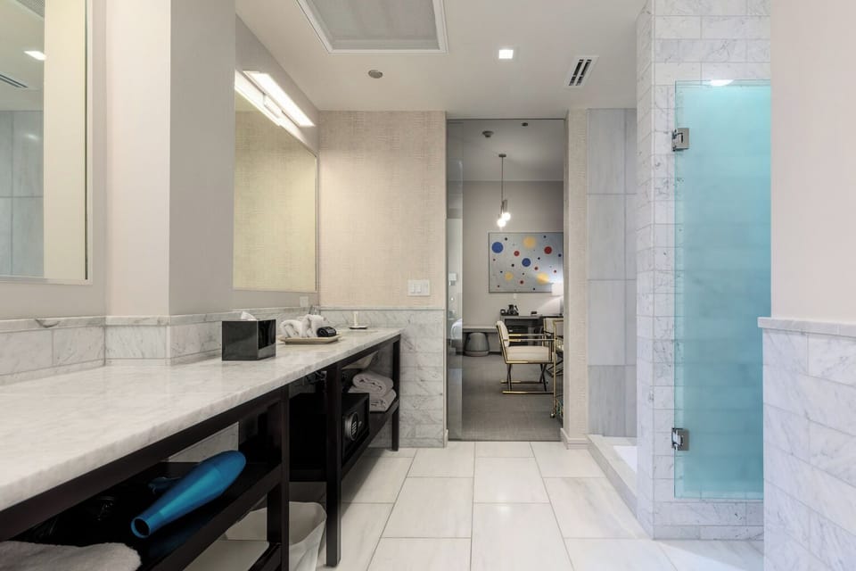 Suite | Bathroom | Shower, designer toiletries, hair dryer, bathrobes