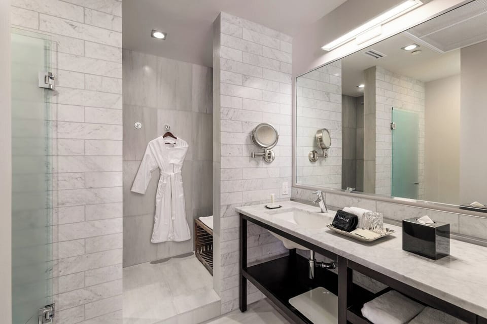 Shower, designer toiletries, hair dryer, bathrobes