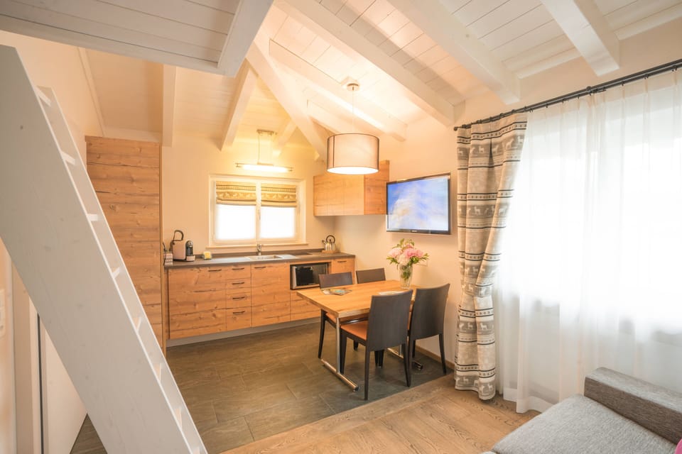 Grand Apartment (Lagalb) | Living area | Flat-screen TV