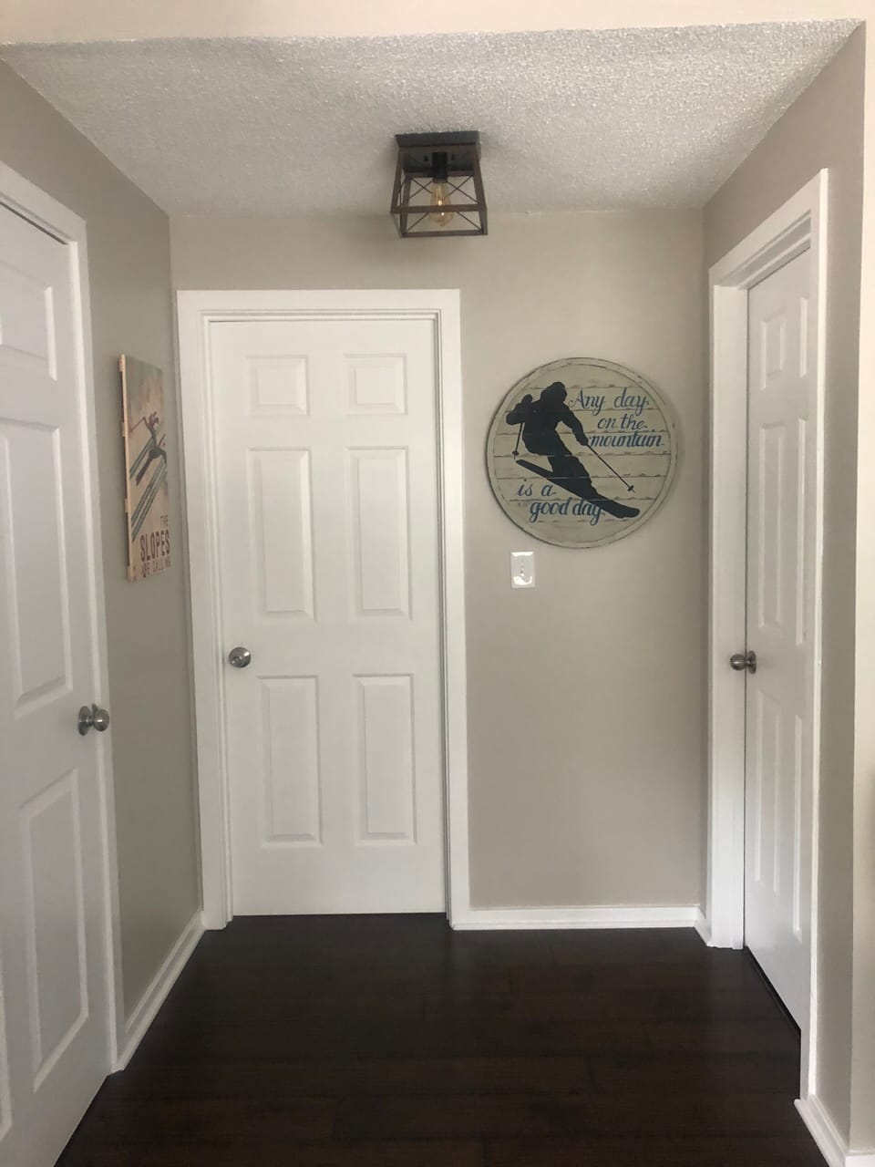 Hallway closet, first floor bathroom master bedroom doors