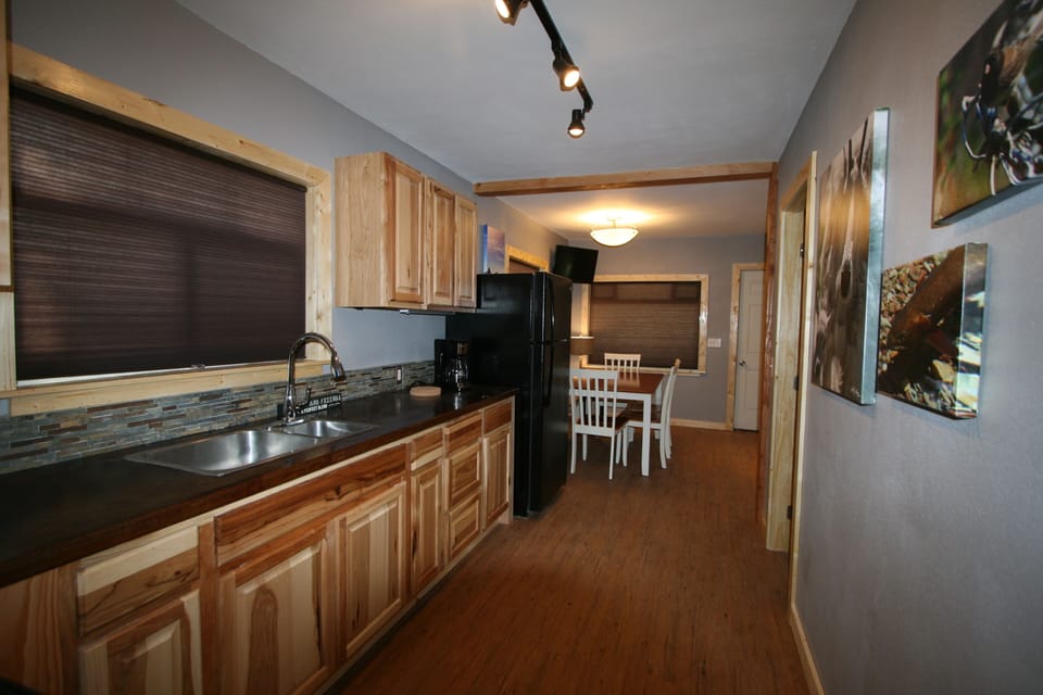 looking towards dining area and living room from kitchen