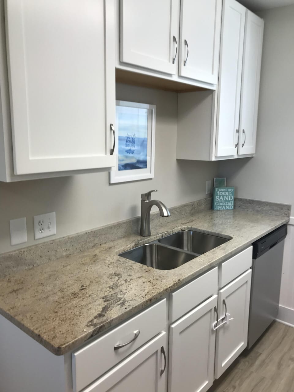 Kitchen with granite counter tops and stainless steel appliances. 