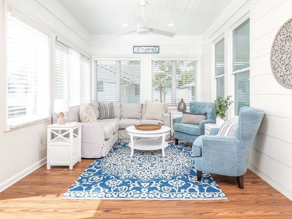 Bright and sunny living area with a large sectional