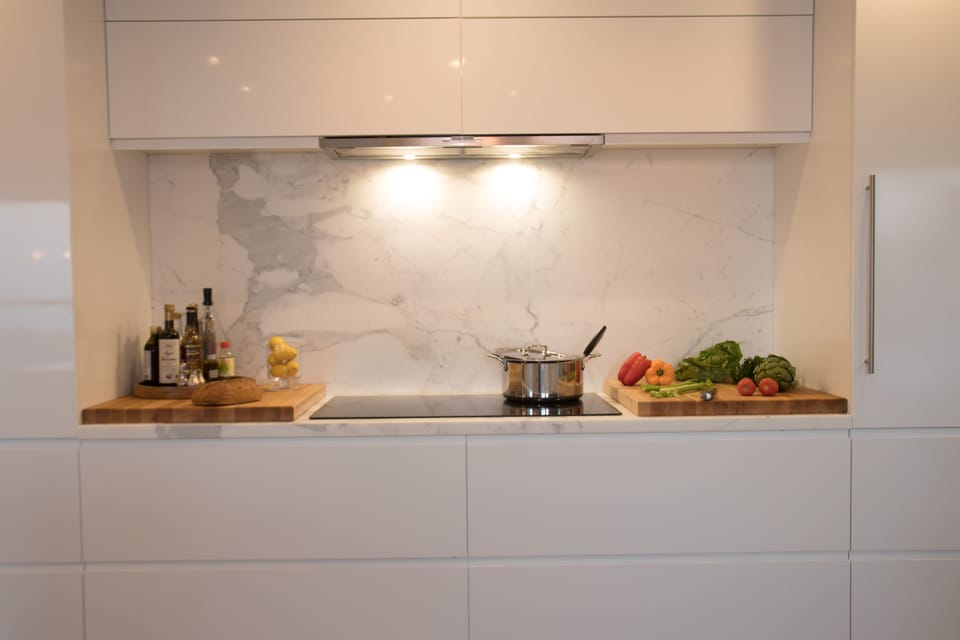- Induction cooktop and Sub-Zero Fridge