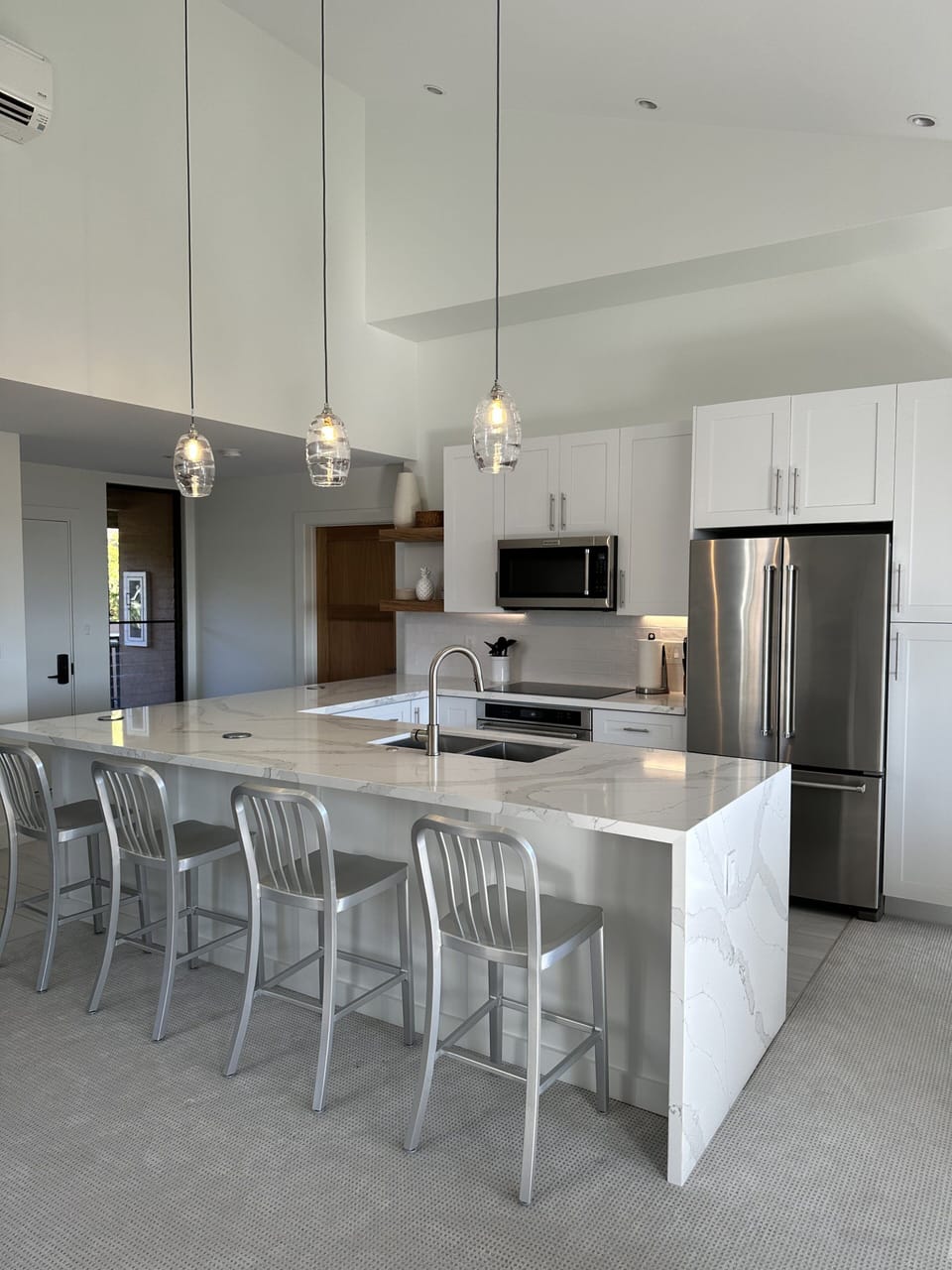 Open kitchen with top of the line appliances and large island. 