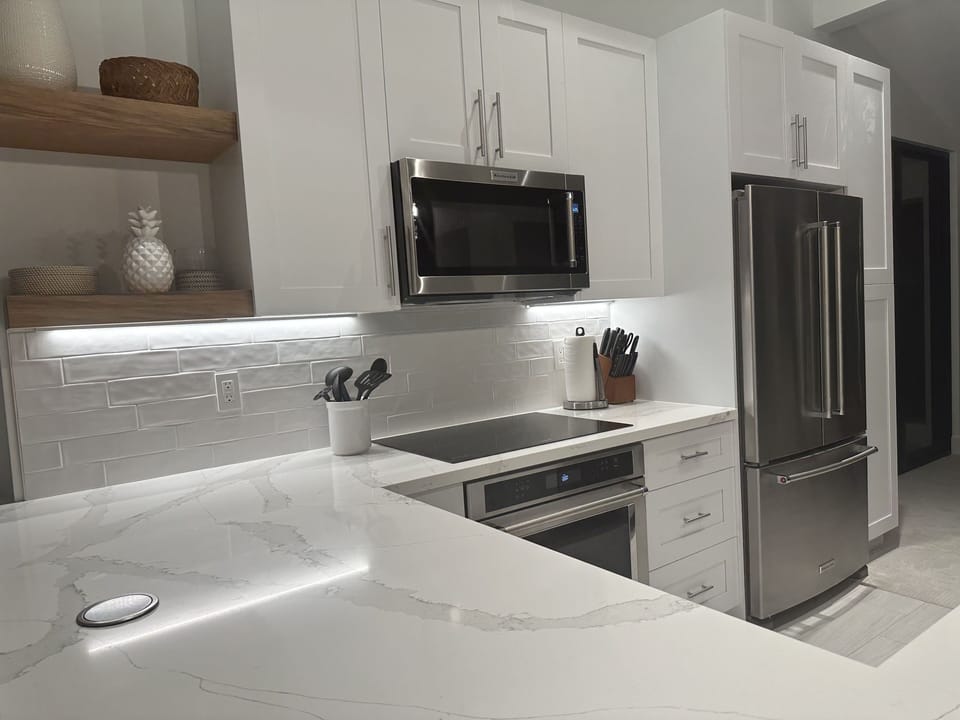 Brand new appliances including induction stove top. 