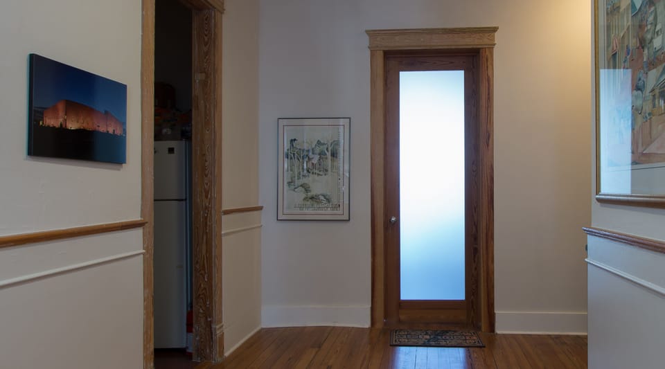The door to the loft is located at the end of the central foyer.