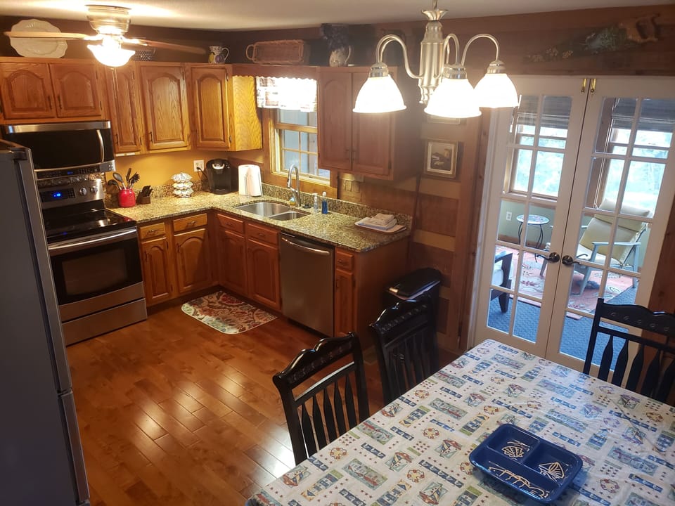 Kitchen with doors leading to sunroom