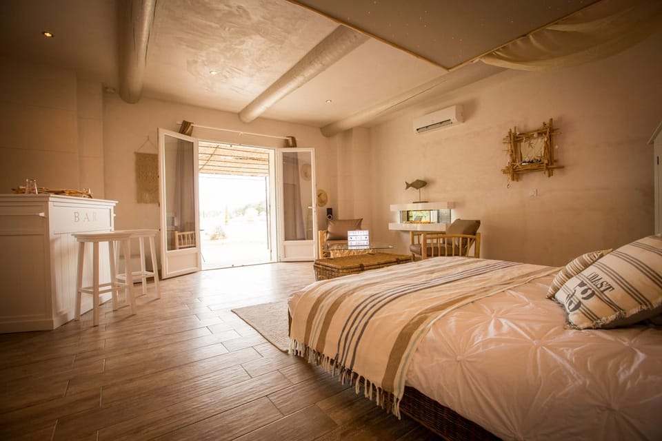 Romantic Suite, Hot Tub (La Paillote) | Minibar, in-room safe, individually decorated, individually furnished