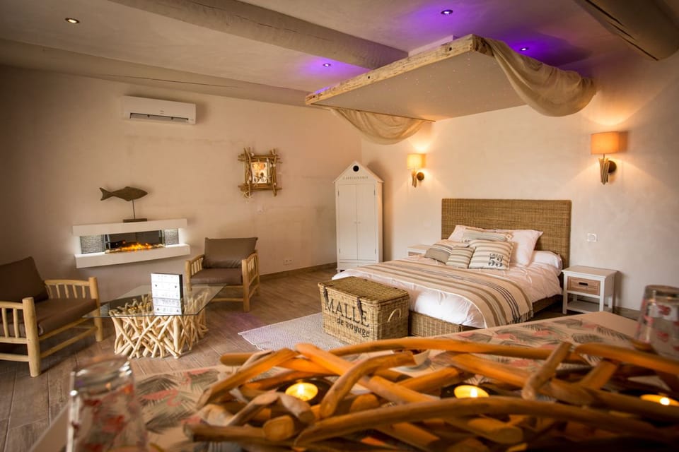 Romantic Suite, Hot Tub (La Paillote) | Minibar, in-room safe, individually decorated, individually furnished