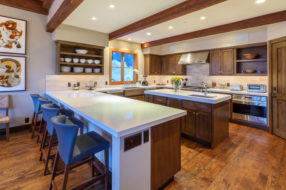 The large kitchen is loaded with top appliances for elegant cooking and catering