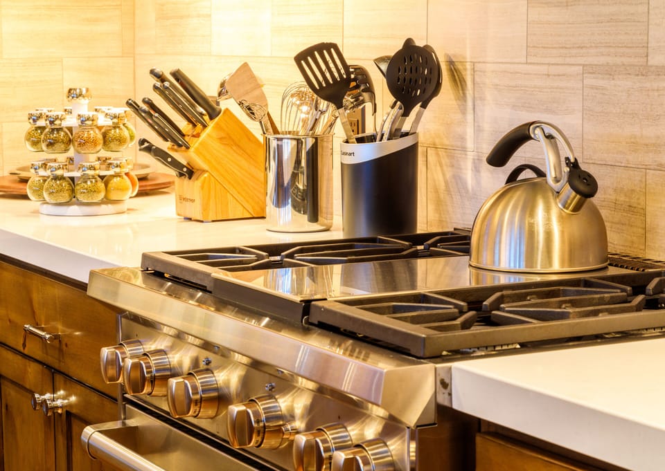 The large kitchen is loaded with top appliances for elegant cooking and catering