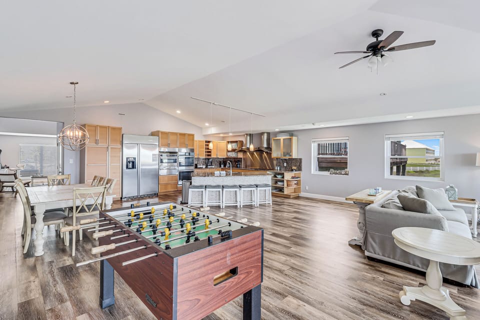 Your spacious open-concept haven combines gourmet cooking, cozy lounging, and friendly foosball matches in one flowing space.