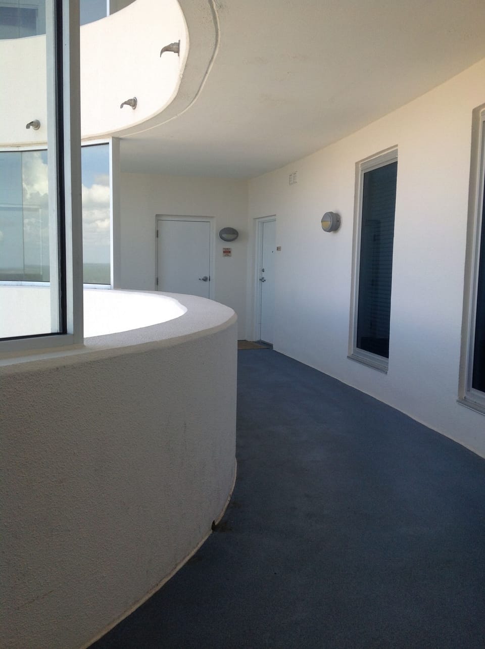 Protected entry with two elevators. one on either side.