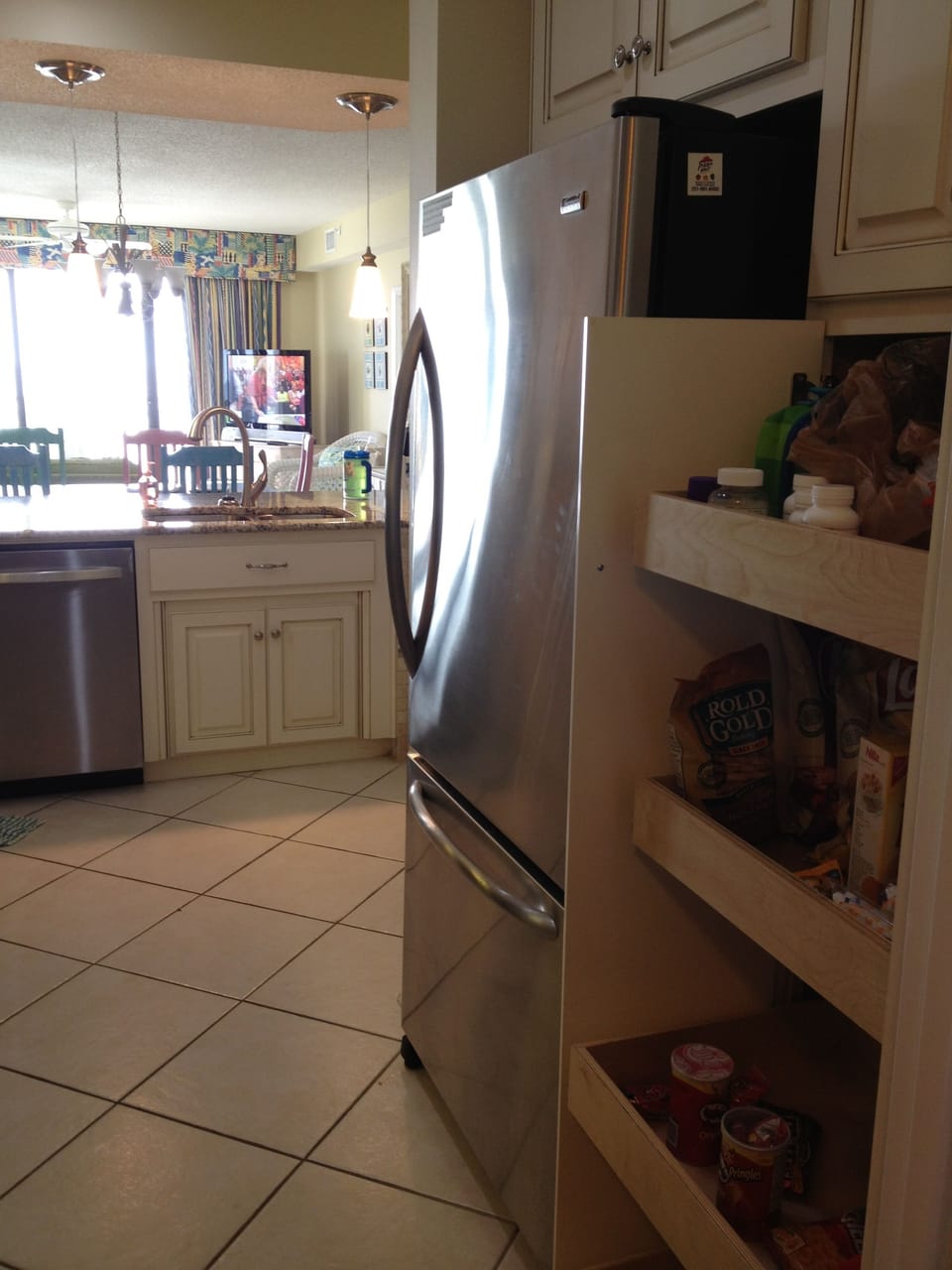 New cabinets with slidng drawers in the pantry.