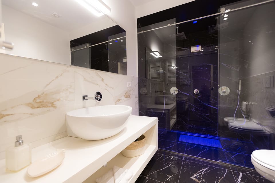 Junior Suite, 1 Bedroom, Balcony | Bathroom | Shower, rainfall showerhead, free toiletries, hair dryer
