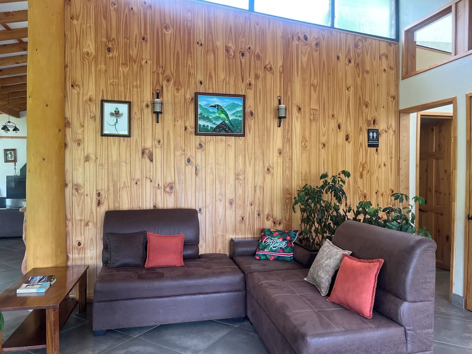 Standard Triple Room | Living area | Fireplace