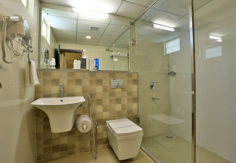 Shower, rainfall showerhead, towels