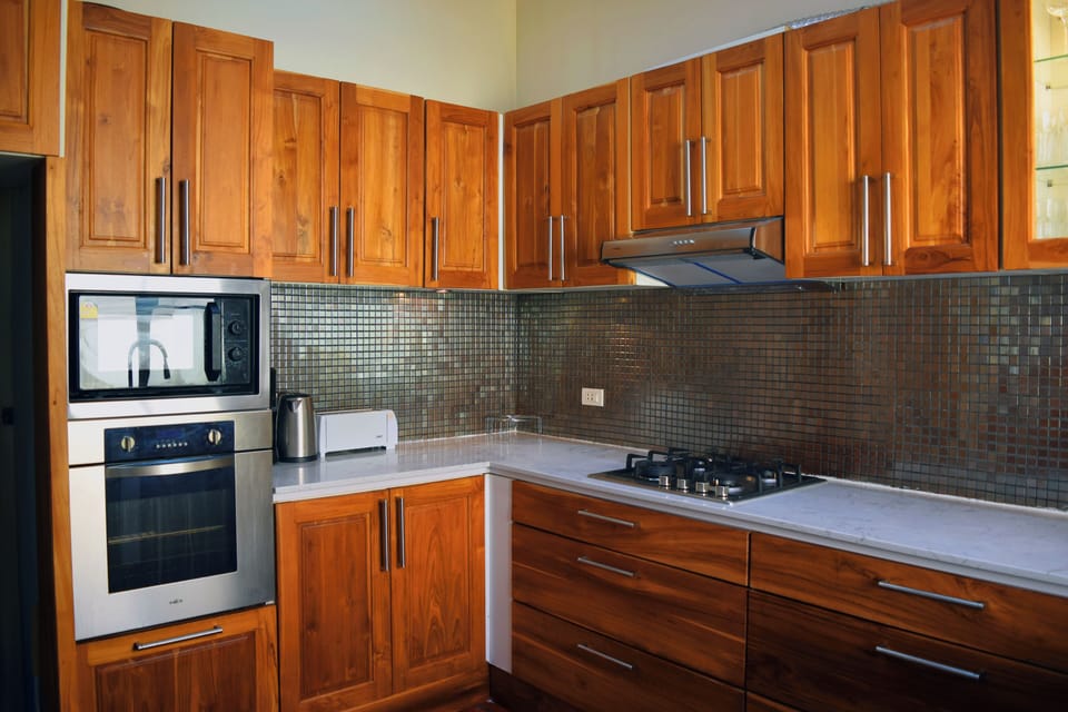modern kitchen with oven, gas hob + microwave