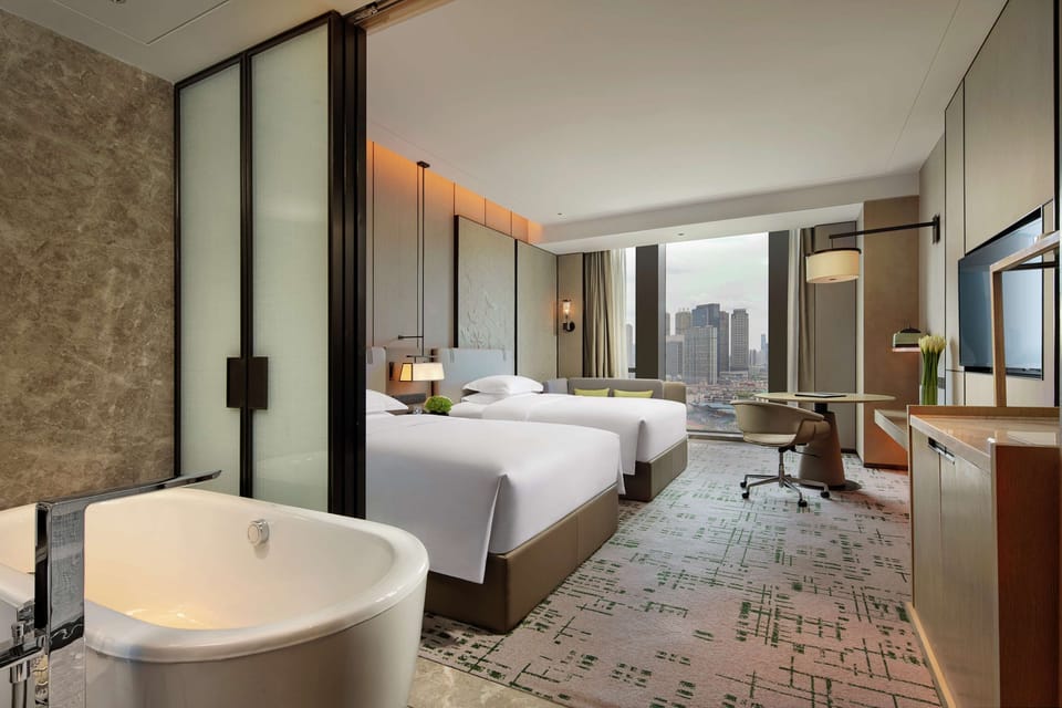 Executive Twin Room | Bathroom | Separate tub and shower, rainfall showerhead, designer toiletries
