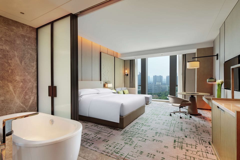 Executive Room, 1 King Bed | Bathroom | Separate tub and shower, rainfall showerhead, designer toiletries