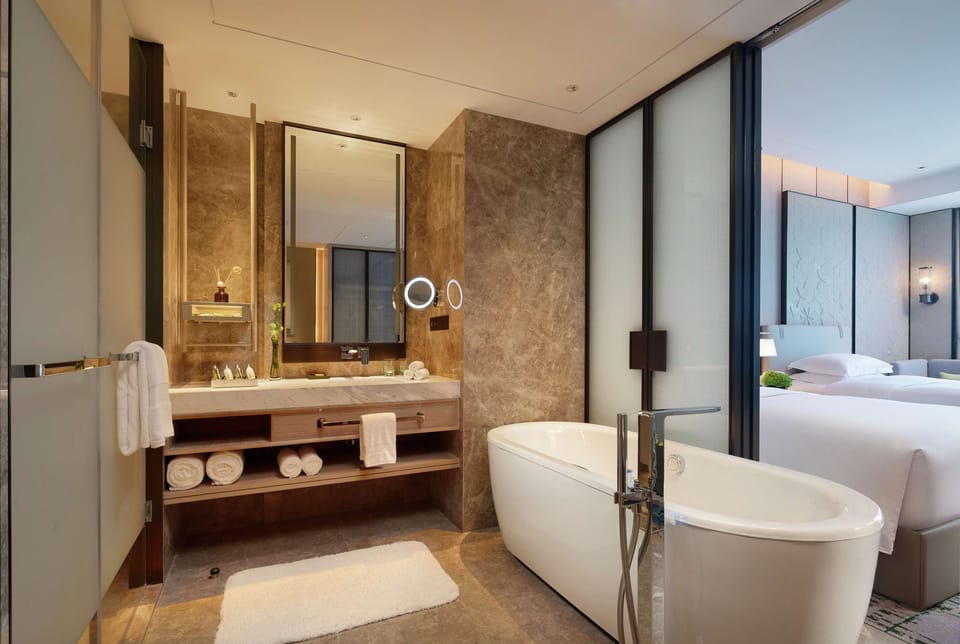 Executive Twin Room | Bathroom | Separate tub and shower, rainfall showerhead, designer toiletries