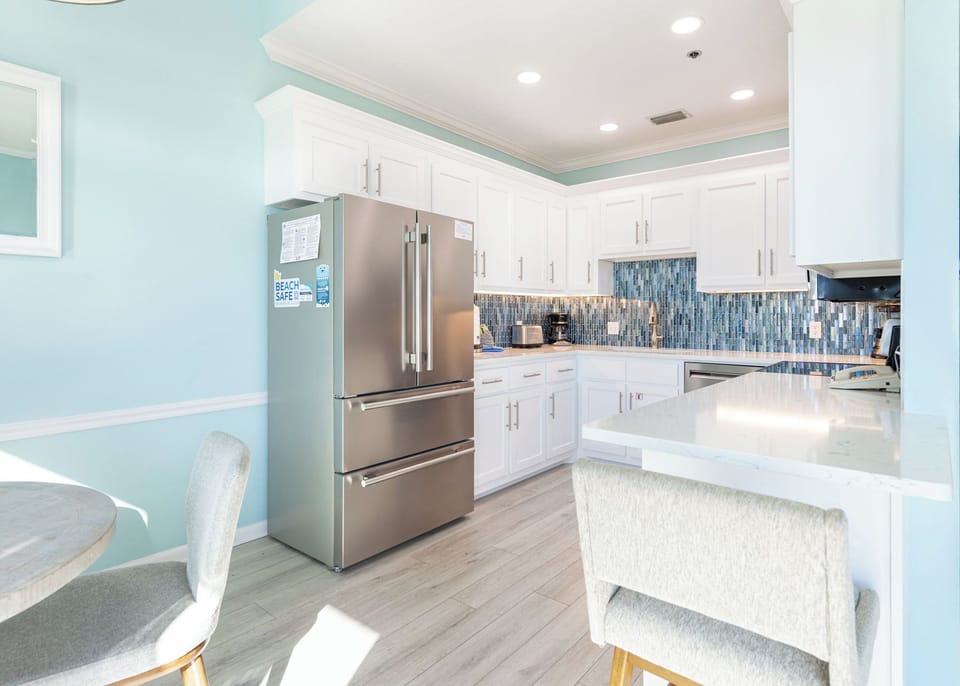 Stainless appliances and a breakfast bar make family meals feel effortless in your kitchen