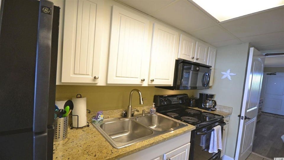 Galley Kitchen with all cooking essentials
